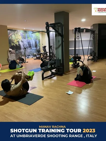 Our holistic approach extends to our international camps. Here, our shooters participate in a physical conditioning session in the gym at the Umbriaverde facility in Italy.