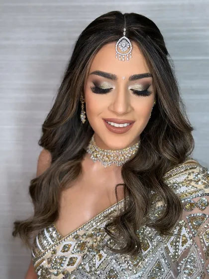 A close-up on the stunning golden glitter eyeshadow. This is a perfect example of a high-glam party look.