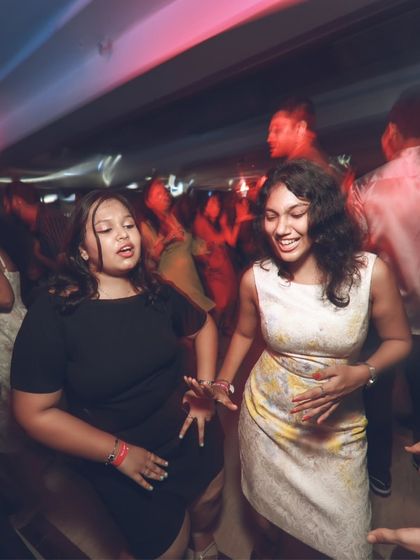 Two friends enjoying the music and dancing together. For me, DJing is about creating these moments of connection and shared happiness.