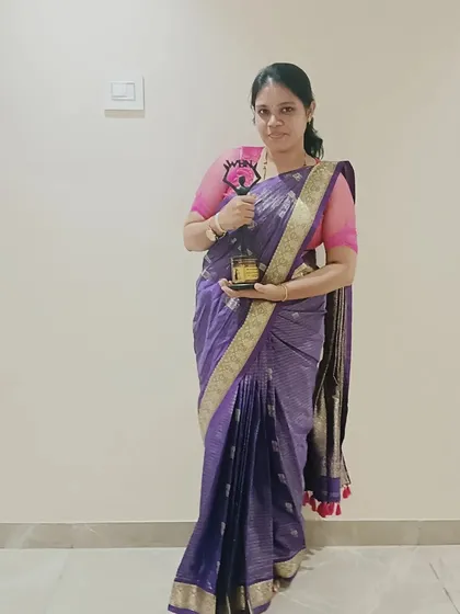 Holding my award with pride. Being a government-certified saree drapist and educator is an achievement I cherish, and I love sharing my expertise in my classes.