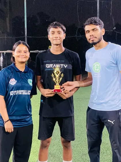 My coaches awarding a trophy to a standout player at the football trials. Recognizing achievement is a key part of my coaching philosophy to build confidence in young athletes.