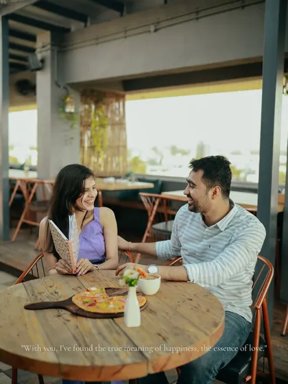 A sweet moment over pizza and coffee at Breeze, a rooftop cafe in Palghar. This shot shows that love is found in the simple, everyday moments you share.