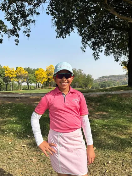 A smiling Aahana Shrivastava on the course, celebrating her win at the JAGA Invitational.