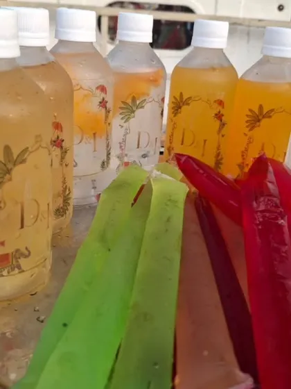 A close-up of our custom-bottled cocktails and colorful alcohol-infused ice pops. This grab-and-go style is perfect for daytime events and pool parties.