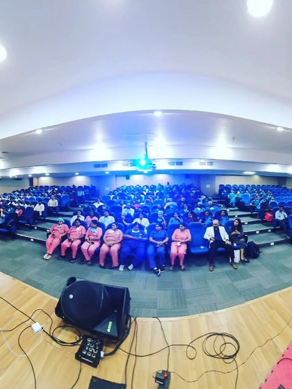 A wide-angle shot from the stage, showing the full auditorium at Narayana Health.