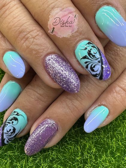 A vibrant and creative set with a mix of ombre, glitter, and tribal-inspired patterns.