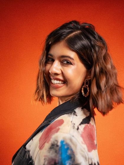 A happy and radiant close-up of Sejal Kumar. This candid-style smile brings a sense of joy and personality to the campaign, making the brand feel relatable and fun.