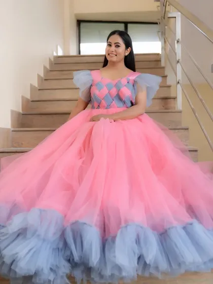 Here's a look at one of our custom-designed ball gowns, worn by the lovely Suguna. The unique pink and grey checkered bodice and full tulle skirt make it a real showstopper for any event or portfolio shoot.