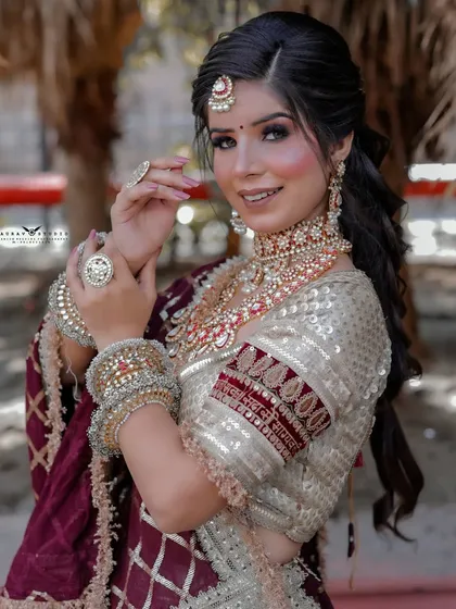A close-up portrait of the bride, her smile lighting up the frame.