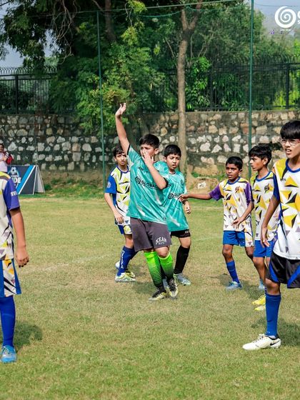 Players from GSC and MVTFA celebrate a moment in the game, showing sportsmanship and joy.