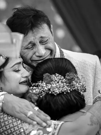 This is the real stuff. The truest stories are not in the smiles for the camera, but in the quiet tears and tight hugs. This moment, a father's emotional embrace, is a testament to the powerful, unseen threads of family that I strive to capture.