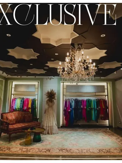 The exclusive bridal section for 'Eclat by Batukbhai', where we created a dramatic and intimate atmosphere. The star-patterned ceiling and a classic crystal chandelier provide a luxurious canopy for the vibrant couture collections on display.
