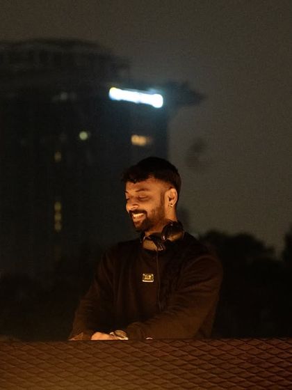 A moment of pure joy, smiling behind the decks. This is what it looks like when I'm completely in my element.