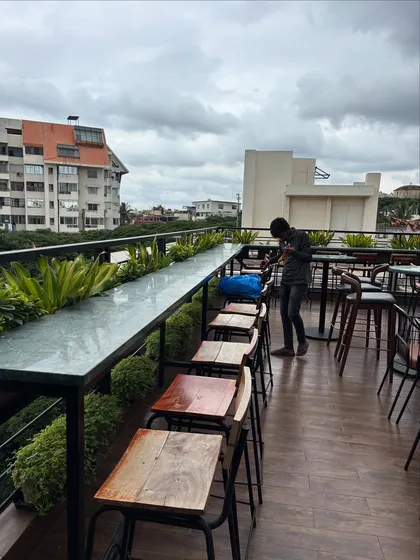 My team member tends to the planters at Masala Martini in Bengaluru. Our ongoing plant care ensures the space maintains its fresh, soft, and inviting atmosphere long after the initial design is complete.