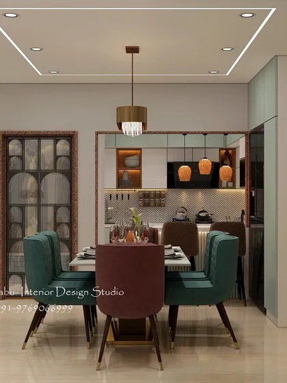This dining space is designed for a modern family, featuring plush, colorful chairs and a sleek marble-top table. The square-patterned false ceiling with profile lighting adds a contemporary geometric element to the room.