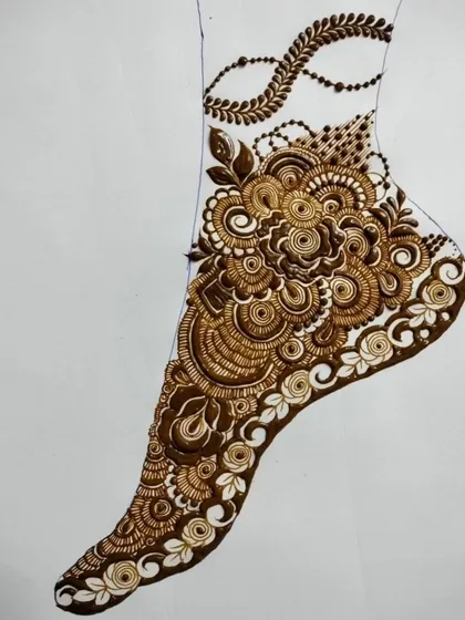An elegant foot design featuring a central floral cluster and a delicate beaded chain (payal) element. This shows how to incorporate jewelry-like features into your henna art.