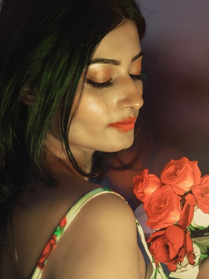 A serene and elegant portrait. Her closed eyes and the soft lighting create a moment of peaceful contemplation.