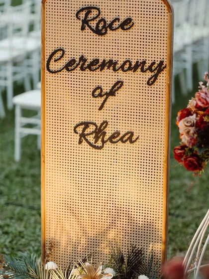 A chic and modern sign for a Roce ceremony. I used a trendy cane-work panel with elegant script to welcome guests, blending rustic texture with sophisticated design.