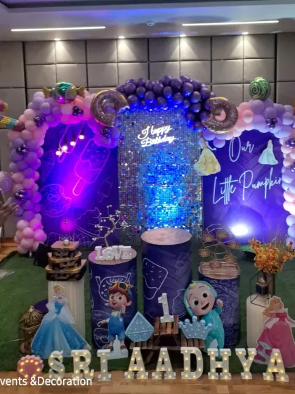 A closer look at the Cocomelon birthday setup, showing the character cutouts and the personalized "Our Little Pumpkin" backdrop.