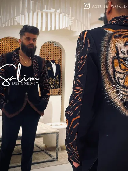 A look at the front and back of my signature hand-painted tiger blazer. This piece combines the ferocity of the motif with the luxury of a perfectly tailored jacket, making it a powerful statement for any occasion.