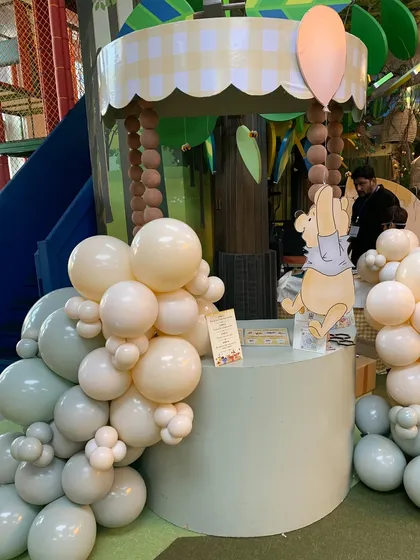 A Winnie the Pooh-themed live stall, ready to serve sweet treats to the party guests.