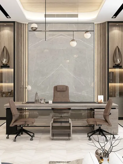 We design executive office spaces that command respect and foster productivity. This director's cabin features a balanced composition of marble, wood paneling, and ambient lighting, creating an environment of authority and refined taste for corporate leaders.