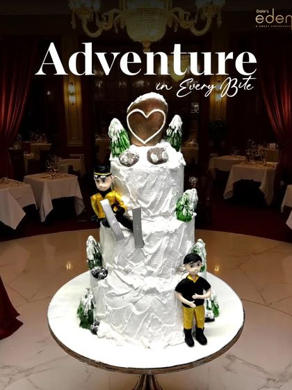 An adventure in every bite. This multi-tiered skiing-themed cake captures a winter wonderland with snowy slopes, frosted trees, and fondant skiers, bringing a cool vibe to any celebration.