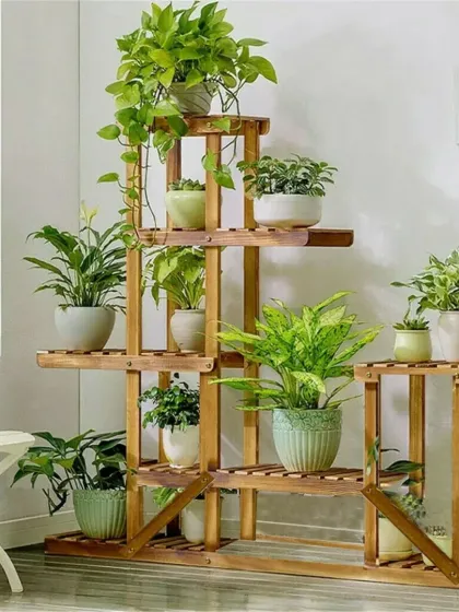 Our multi-tiered bamboo planter stand, elegantly displaying a variety of houseplants. This stand is designed to maximize vertical space, allowing you to create a lush indoor garden in any corner of your home. It is easy to assemble and transport.