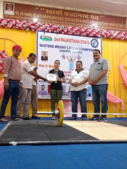 My client receiving her award on the competition stage. A proud moment for any coach.