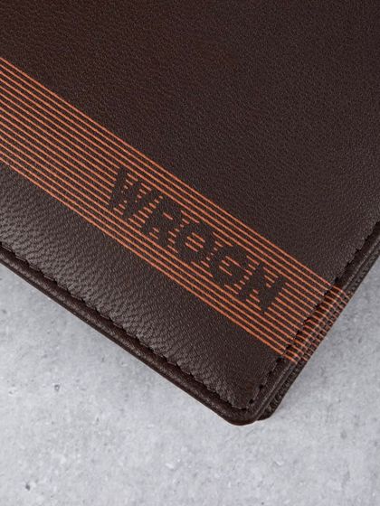 A macro shot of the striped design and logo on the 'WROGN' wallet.