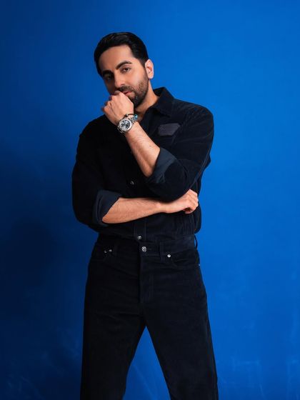 A thoughtful pose that adds a different dimension to the series, showing a more pensive side.