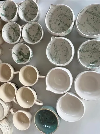 I was so excited to create a full tableware set for a new matcha cafe. This large order included hand-pinched mugs with a green splash glaze, tea pourers, and whisker stands, all designed to give an organic, unique feel to their brand.