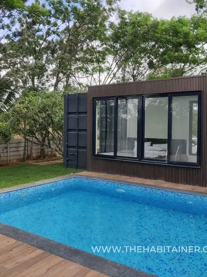 A stunning container home with a pool, perfect for a relaxing getaway.