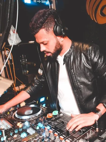 Focused and ready. Here I am at the console, lining up the next track. A good set is a story, and I'm always thinking a few beats ahead to make sure the narrative flows perfectly.