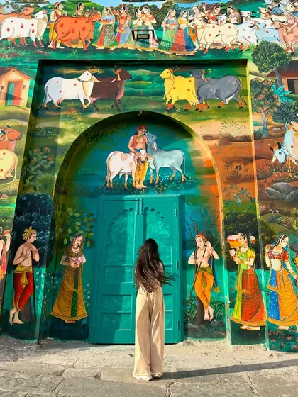 My travels aren't just about beaches; they're about discovering the beauty and culture of a place. Standing in front of this incredible, colorful mural in India was a reminder of how much art and history we get to experience.