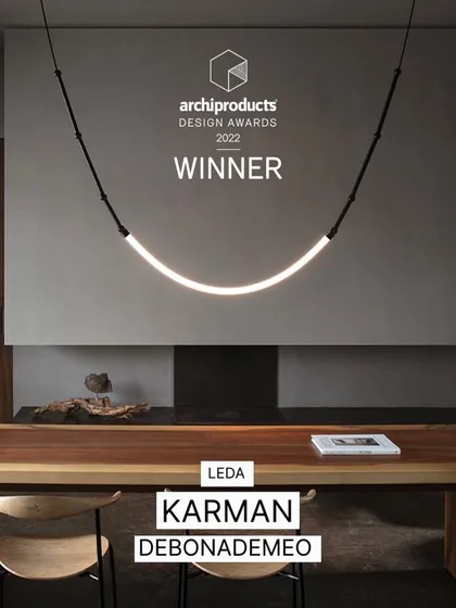 The award-winning Leda design by Karman. This image shows a single, graceful arc of light, a testament to the beauty of its simple, flexible form.