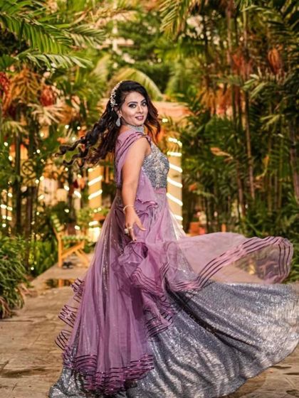 A twirl-worthy gown for a magical evening. The glittering layers of this lavender dress catch the light beautifully, perfect for dancing the night away at your reception.