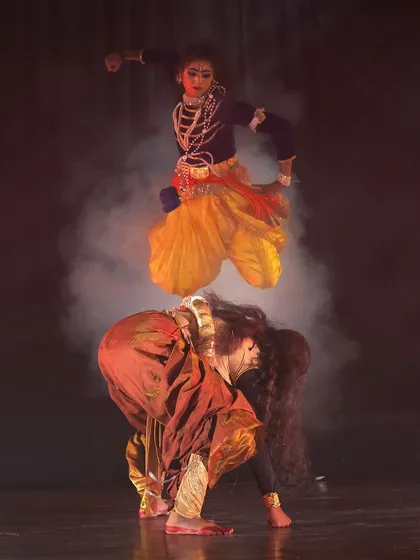 The energy and athleticism of our dancers are central to our productions. This dynamic leap from our "KRISHNA" dance drama captures the playful and powerful spirit of the divine, a moment of pure joy and devotion on stage.
