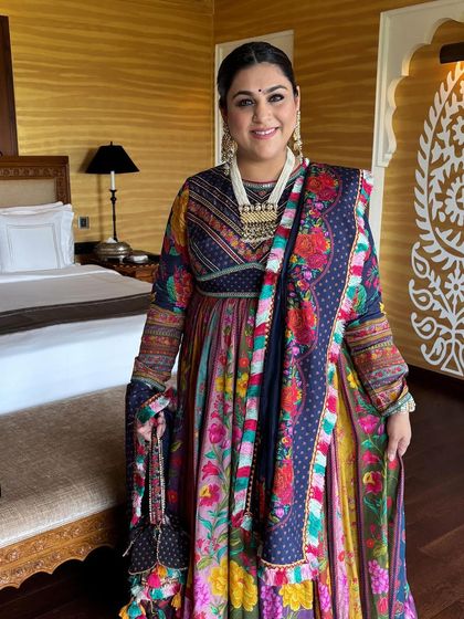 A client ready for Navratri celebrations with a beautiful braided hairstyle. The hair is braided from the front and tied into a low ponytail braid, perfect for dancing.