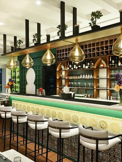 Welcome to our bar. We designed this space to be both modern and inviting, with warm lighting and comfortable seating, making it the perfect backdrop for after-work drinks or a night out with friends.