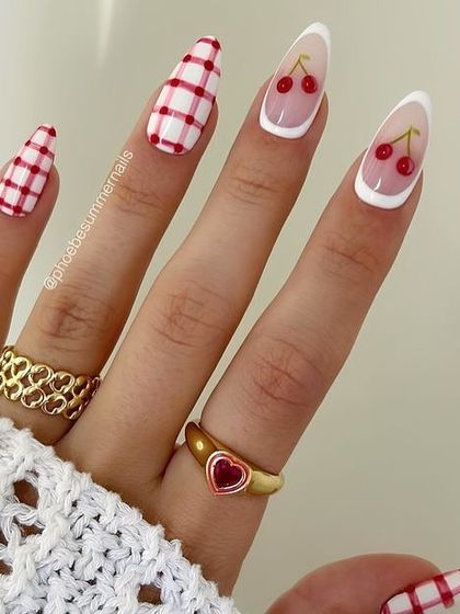 A classic red and white version of the cherry and plaid nail art trend. The white French tip makes the cherry art pop.