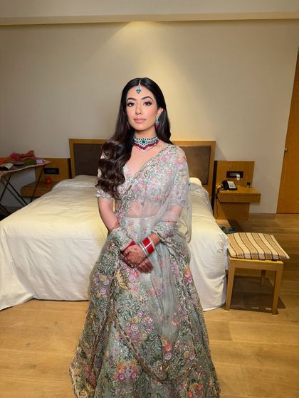 A full-length shot of the bride in her reception outfit. The overall look is light, airy, and perfect for a special evening.