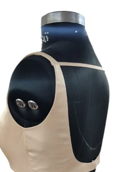 The clean lines and perfect fit of this bustier are shown from the side. Each piece is crafted to be uniquely you.