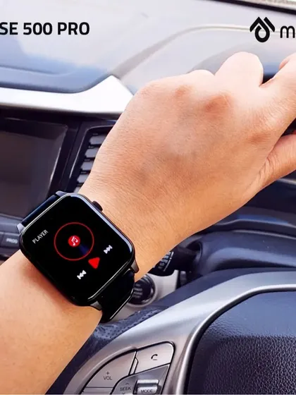 Capturing the music player feature of the smartwatch while on the go. This in-car shot shows how the product seamlessly integrates into a user's active lifestyle, from work to commute.