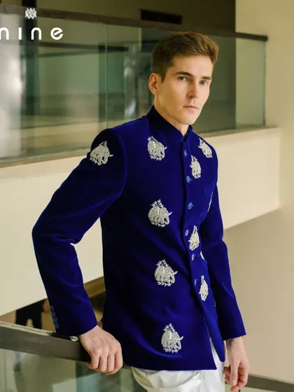 For me, clothing should tell a story. This royal blue velvet bandhgala is a perfect example, featuring hand-embroidered silver elephants that celebrate our rich Indian motifs. It's a bold, regal piece, tailored for those milestone celebrations.