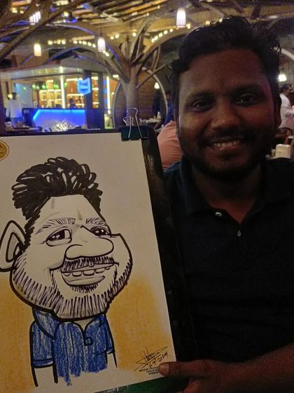 A guest at Mountain High, happy with his drawing.