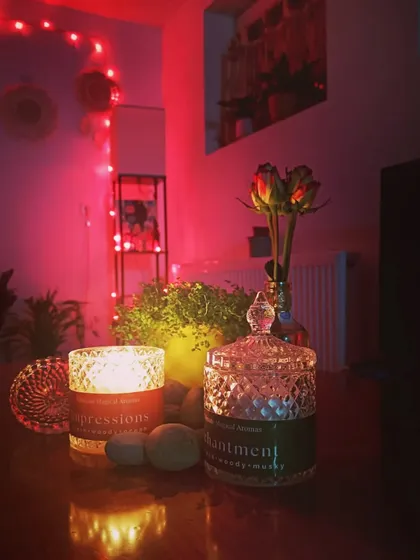A customer's photo of my Crystal Jar Candles, 'Impressions' and 'Enchantment', used to create a magical and cozy Valentine's Day eve. It warms my heart to see my candles in your special moments.