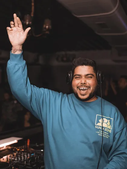 Waving to the crowd, feeling the love. It's a community vibe.