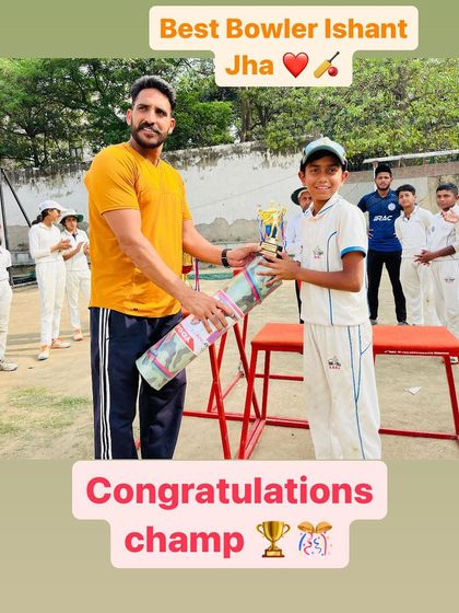 Ishant Jha, awarded Best Bowler of the tournament, with his prize.