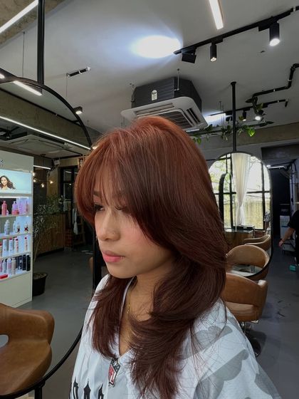 Another view of the hush haircut, showing how the layers create movement and texture, enhancing the overall color.